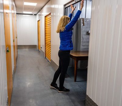 Woman closing storage unit